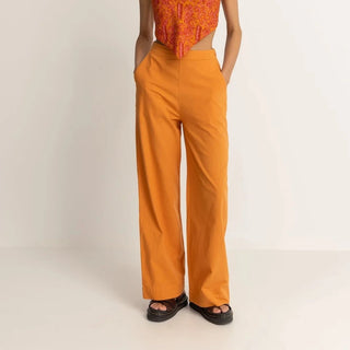 Orange wide leg pants with high tailored waistband and relaxed fit.