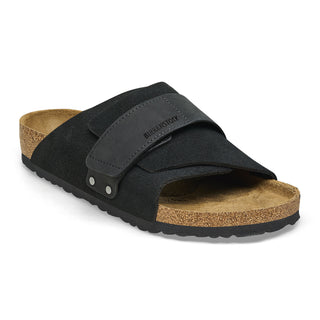 Black Birkenstock Kyoto sandals with nubuck/suede upper, adjustable hook and loop closure, and comfortable footbed.