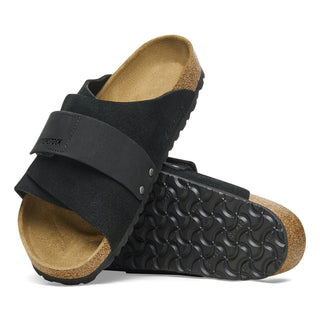 Black Birkenstock Kyoto sandals with nubuck/suede upper, adjustable hook and loop closure, and comfortable footbed.