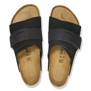 Black Birkenstock Kyoto sandals with nubuck/suede upper, adjustable hook and loop closure, and comfortable footbed.