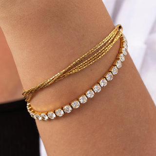 Gold Hemingway bracelet with 18K gold-filled finish, cubic zirconia, fold-over clasp, and hypoallergenic design.