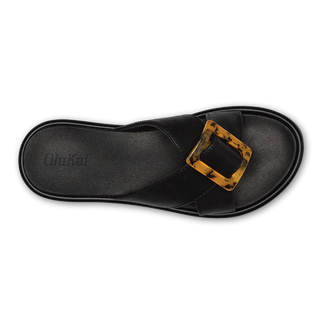 Olukai La'i Slide Women's Sandals in Black with tortoise shell buckle.