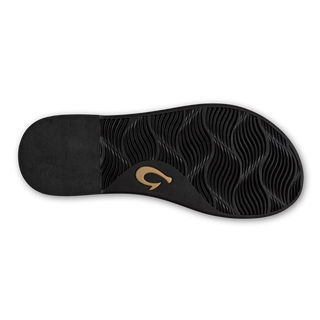 Olukai La'i Slide Women's Sandals in Black with tortoise shell buckle.