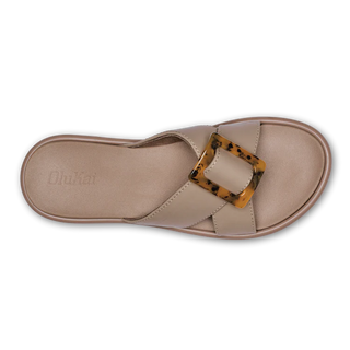 Olukai La'i Slide Women's Sandals in Taupe with tortoise shell buckle.