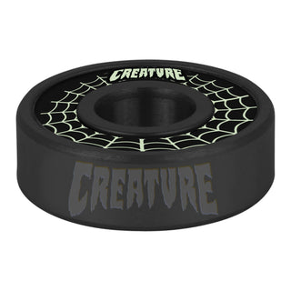 Bronson Speed Co X Creature Skateboards G3 bearings with spider web graphic and glow-in-the-dark coffin box.