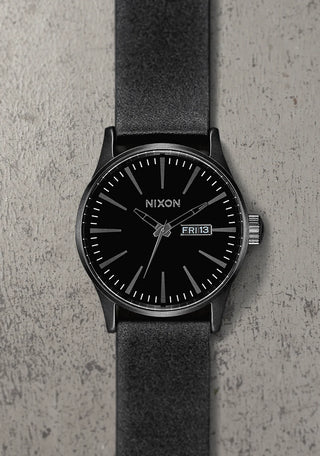 All black Nixon Sentry Leather Analog Watch with stainless steel case and custom leather band.

