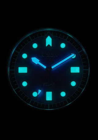 Nixon Stinger 44 Watch featuring a blue dial, stainless steel case, and bracelet, with luminous indices.