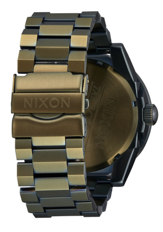 Nixon Corporal Stainless Steel watch with black sunray dial, oversized bezel, and faceted 3-link bracelet.