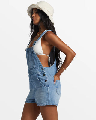 Billabong Sand Canyon Denim Short Overalls in Light Wash with adjustable straps and multiple pockets.