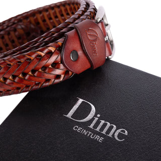 Caramel and brown braided leather belt with timeless design.