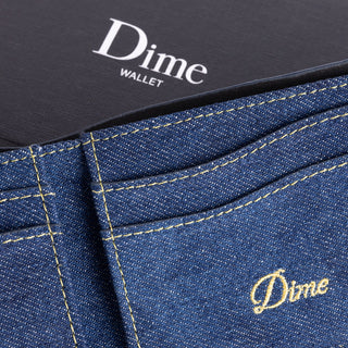 Indigo denim bifold wallet with sleek design and durable construction.