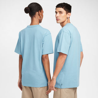 Nike SB Skate T-Shirt in Denim Turquoise, midweight cotton with a ribbed collar for comfort and easy layering.