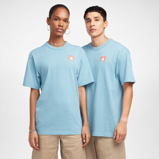 Nike SB Skate T-Shirt in Denim Turquoise, midweight cotton with a ribbed collar for comfort and easy layering.