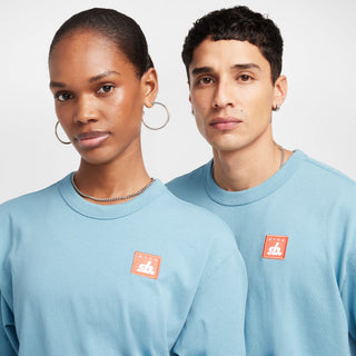 Nike SB Skate T-Shirt in Denim Turquoise, midweight cotton with a ribbed collar for comfort and easy layering.