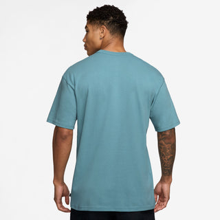 Nike SB Skate T-Shirt in Denim Turquoise, midweight cotton with a ribbed collar for comfort and easy layering.