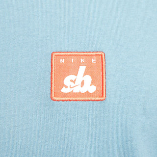 Nike SB Skate T-Shirt in Denim Turquoise, midweight cotton with a ribbed collar for comfort and easy layering.