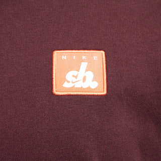 Nike SB Skate T-Shirt in Burgundy Crush with ribbed collar and relaxed fit.