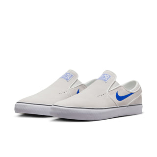 Nike SB Janoski+ Slip Shoes in Summit White and Hyper Royal, featuring suede upper and Zoom Air cushioning.