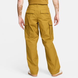 Nike SB Kearny cargo skate pants in Bronzine, durable ripstop fabric, six pockets, drawcord waist.