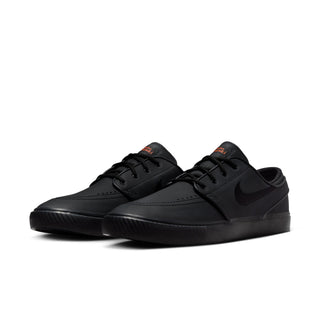 Black Nike SB Zoom Janoski OG+ ISO skate shoes with leather upper and vulcanized sole.