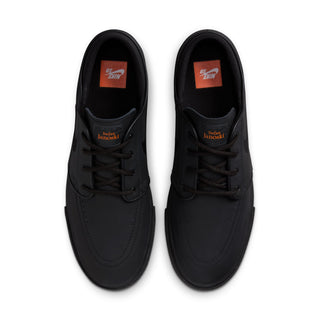 Black Nike SB Zoom Janoski OG+ ISO skate shoes with leather upper and vulcanized sole.