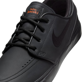 Black Nike SB Zoom Janoski OG+ ISO skate shoes with leather upper and vulcanized sole.