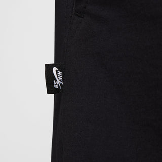 Nike SB Kearny Cargo Skate Pants in Black with six pockets and webbing belt.