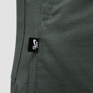 Nike SB Kearny Cargo Skate Pants in Vintage Green with six pockets and webbing belt.