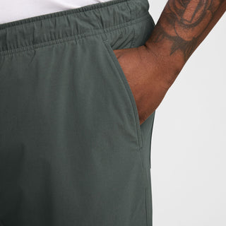 Nike SB Kearny Cargo Skate Pants in Vintage Green with six pockets and webbing belt.