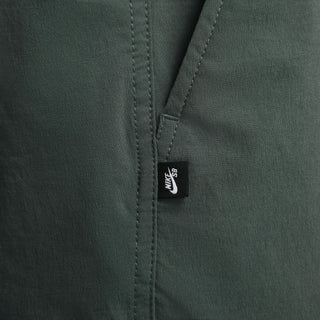 Nike SB Kearny Cargo Skate Pants in Vintage Green with six pockets and webbing belt.