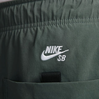 Nike SB Kearny Cargo Skate Pants in Vintage Green with six pockets and webbing belt.