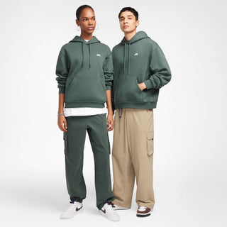 Nike SB green fleece pullover hoodie with logo and roomy fit.

