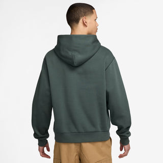 Nike SB green fleece pullover hoodie with logo and roomy fit.

