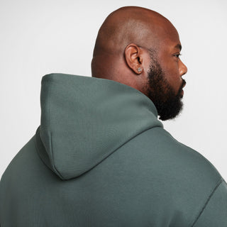 Nike SB green fleece pullover hoodie with logo and roomy fit.

