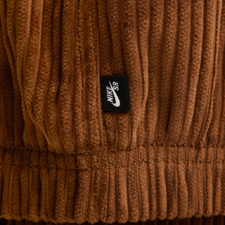 Nike SB Full-Zip Hooded Corduroy Skate Jacket with roomy fit, sweat-wicking lining, and classic skateboarding details.