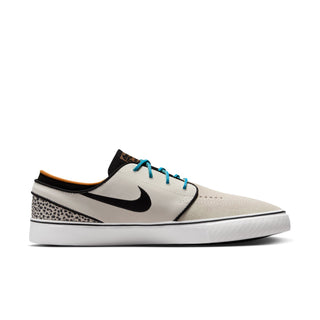 Nike SB Zoom Janoski OG+ Electric in Phantom/Chlorine Blue-Black with suede upper and Zoom Air cushioning.