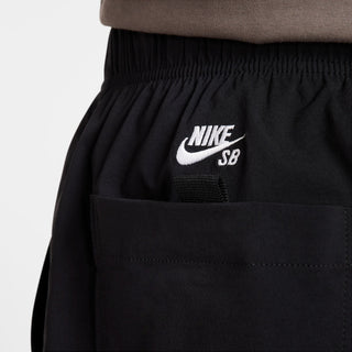 Nike SB Dri-FIT Kearny Cargo Skate Shorts in Black with sweat-wicking fabric and secure pockets.