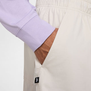 Nike SB Dri-FIT Kearny Cargo Skate Shorts in Light Bone with sweat-wicking fabric and secure pockets.