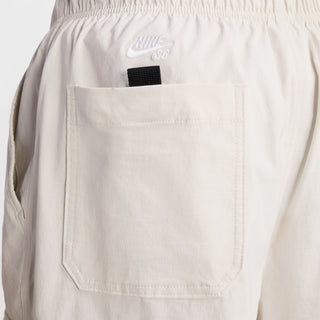 Nike SB Dri-FIT Kearny Cargo Skate Shorts in Light Bone with sweat-wicking fabric and secure pockets.