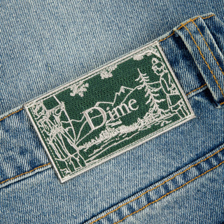 Dime Classic Relaxed Denim Pants in Sandblasted Indigo with wavy patch pockets and embroidered logo.