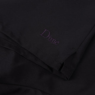 Black shorts with elastic waistband, side slits, and embroidered logo.