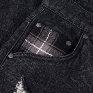 Black washed denim pant with flannel lining, wavy pockets, and distressing.