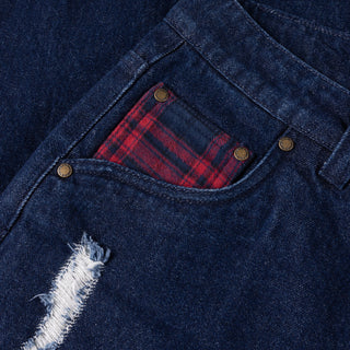 Indigo denim pants with flannel lining, distressing, and wavy pockets.