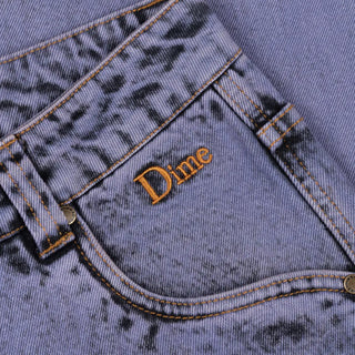 Stone purple relaxed denim pants with logo embroidery and wave patch pockets.