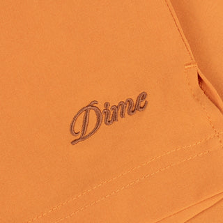 Dime MTL Secret Swim Shorts in Orange with water-reactive print and cursive logo embroidery.