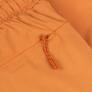 Dime MTL Secret Swim Shorts in Orange with water-reactive print and cursive logo embroidery.