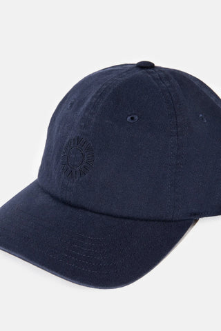 Vintage-style navy cap with sun logo embroidery and adjustable strap.