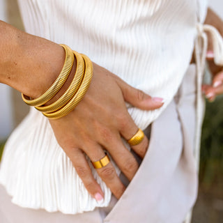 Gold Earthbound Bangle with 18K plating, root-inspired design, hypoallergenic, and water-resistant.