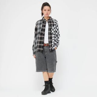 Black plaid shirt with wavy seams and embroidered chest pocket.