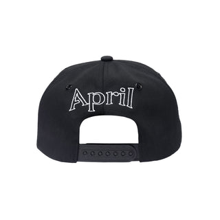 April EMB Snapback in black with white front and back embroidery, high-profile, 5-panel.